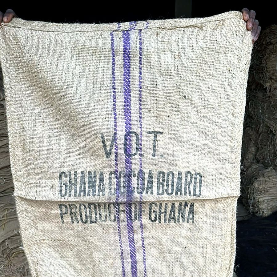 A new-grade jute bag with printed markings, held open