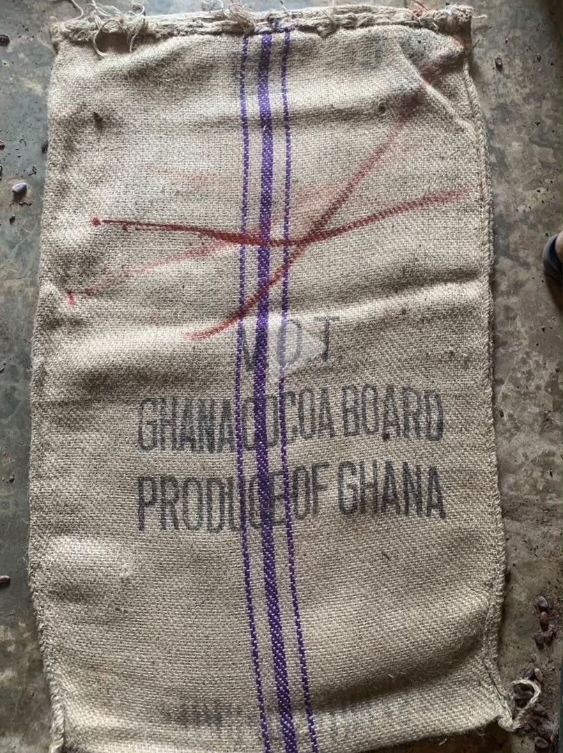 Close detail of a reconditioned jute bag, showing the weave and printed markings